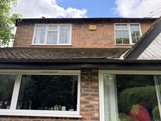 Original white windows with Georgian bars at an Altrincham home before replacement