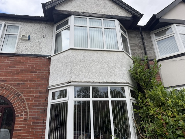 Front view of Mark's original two-storey bay window in Stretford before rebuilding.