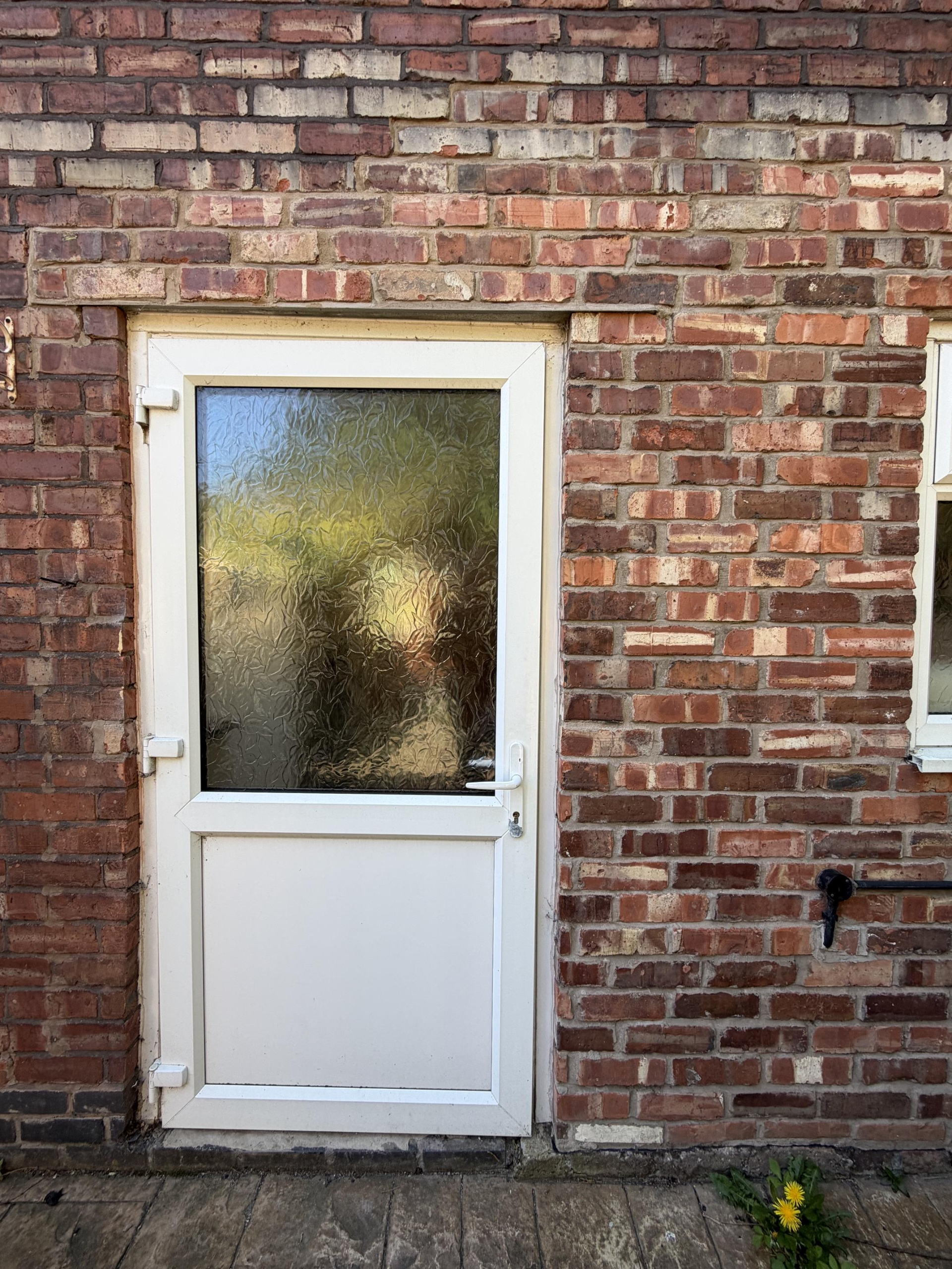 Original single uPVC back door before opening was widened