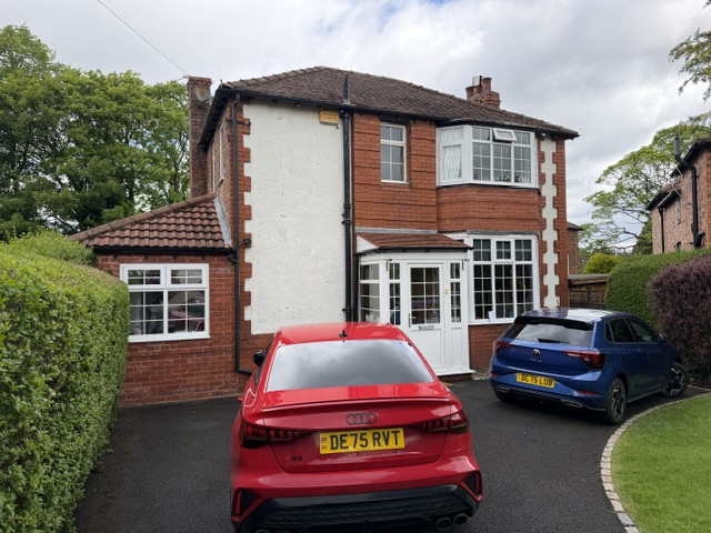 Altrincham home with white windows and Georgian bars before replacement
