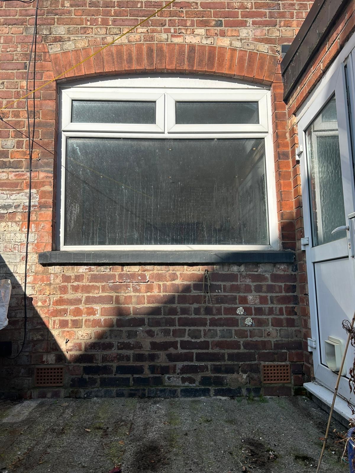 Existing rear window before conversion to French doors in Stretford