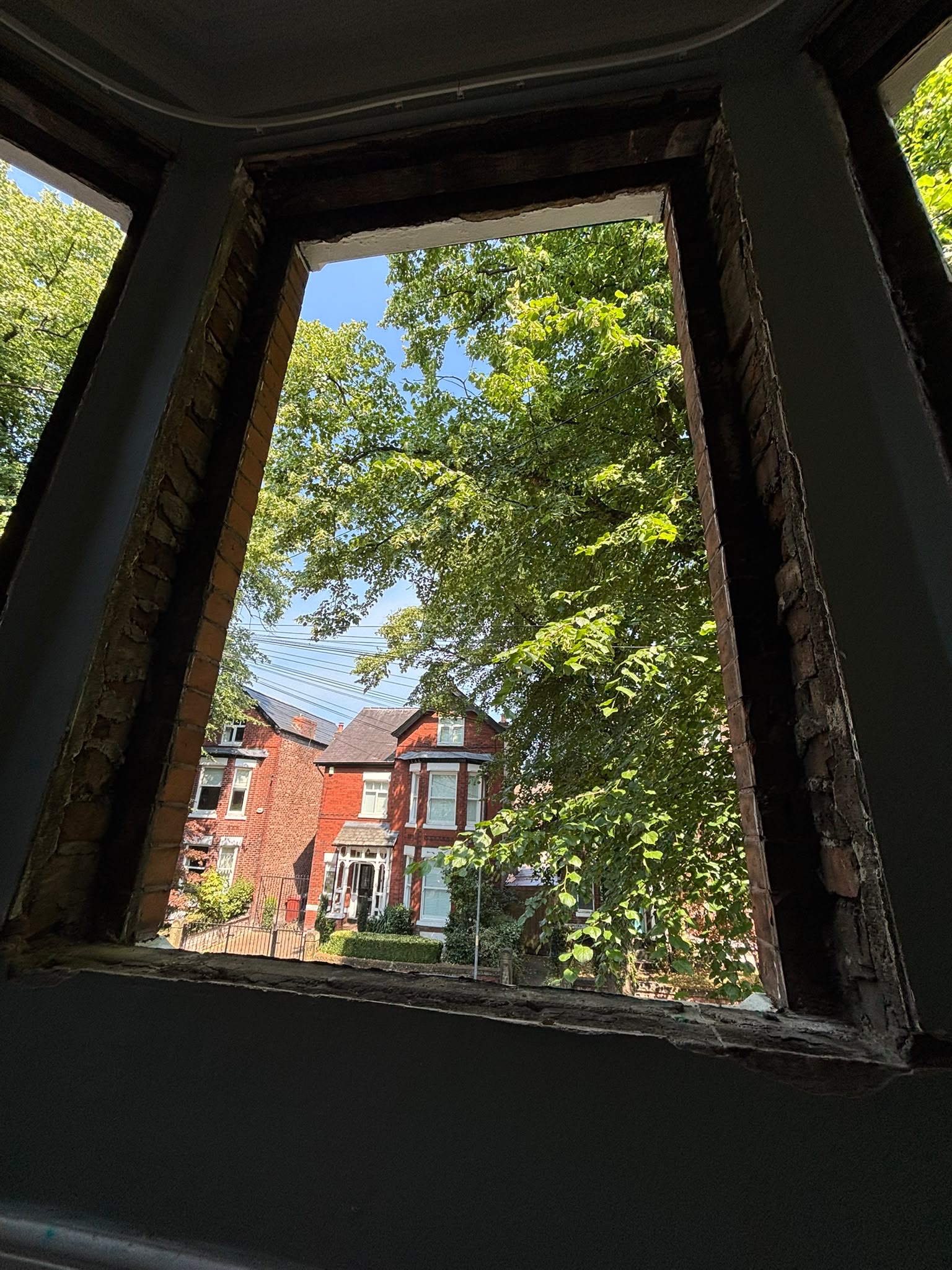 Exposed brick window opening during sash window replacement in a Chorlton period home