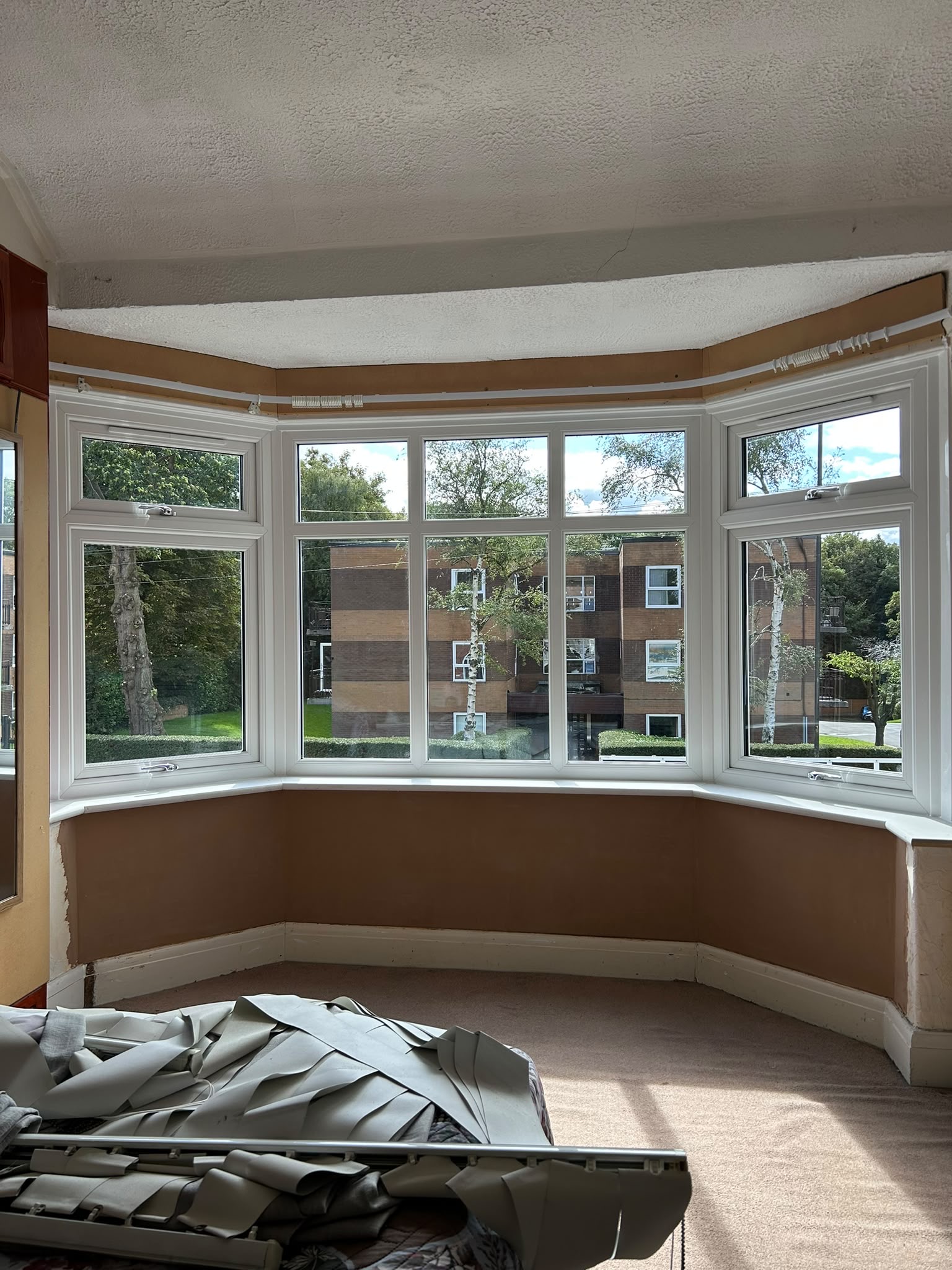 Interior view of the new bay window and fresh plasterwork during finishing.