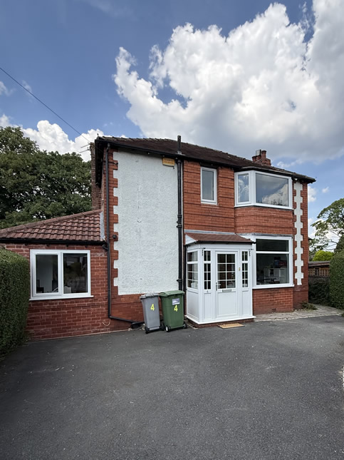 Altrincham home after white replacement windows with larger glazed areas were fitted