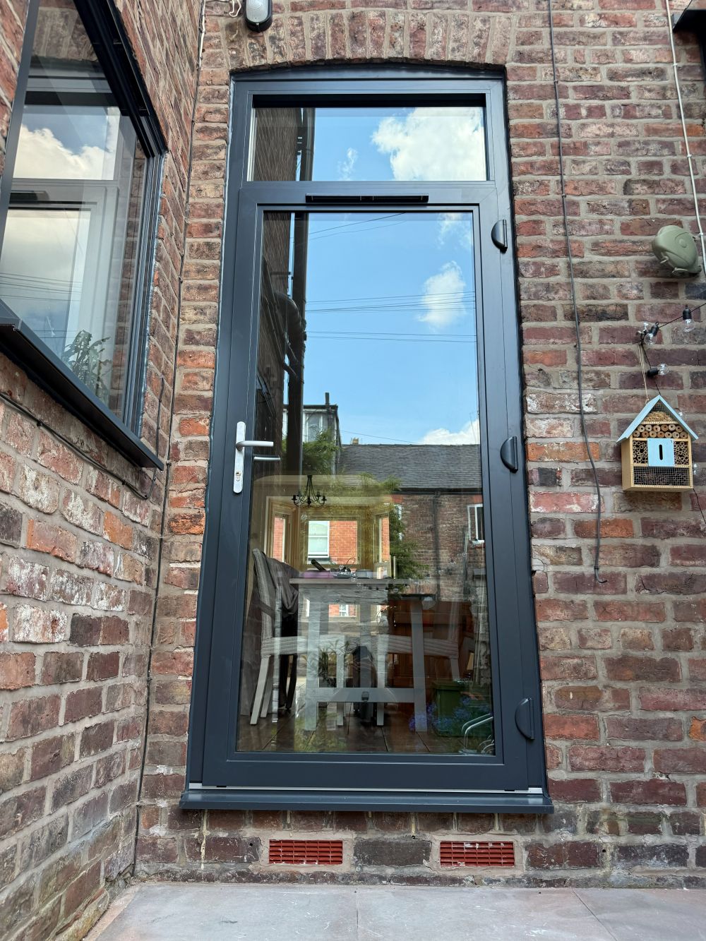 Grey aluminium glazed rear door after installation at an Altrincham home