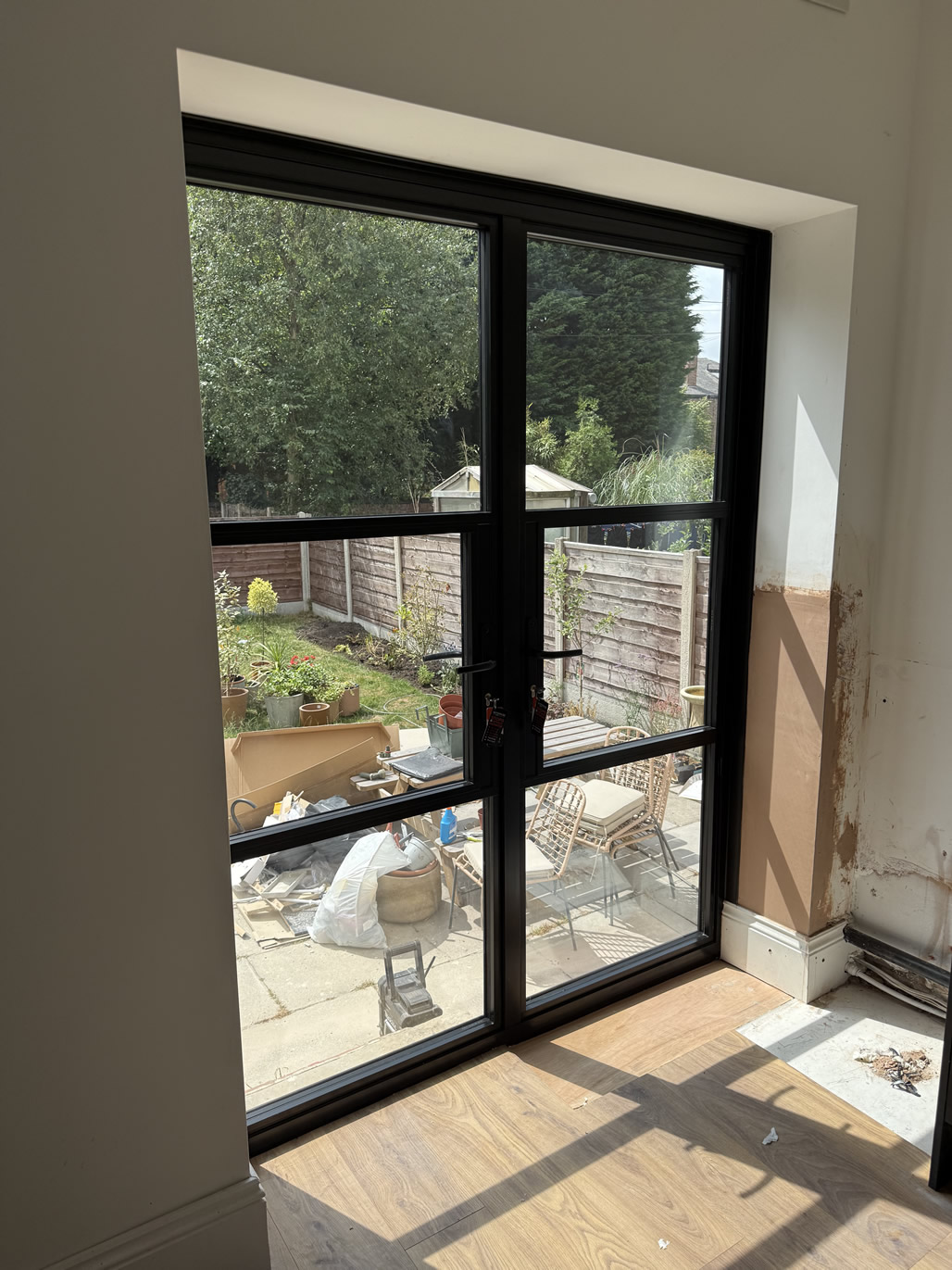 Internal view of heritage-style aluminium doors during renovation
