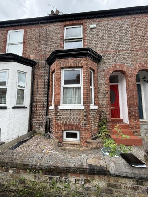Victorian home in Altrincham with white uPVC casement windows before replacement