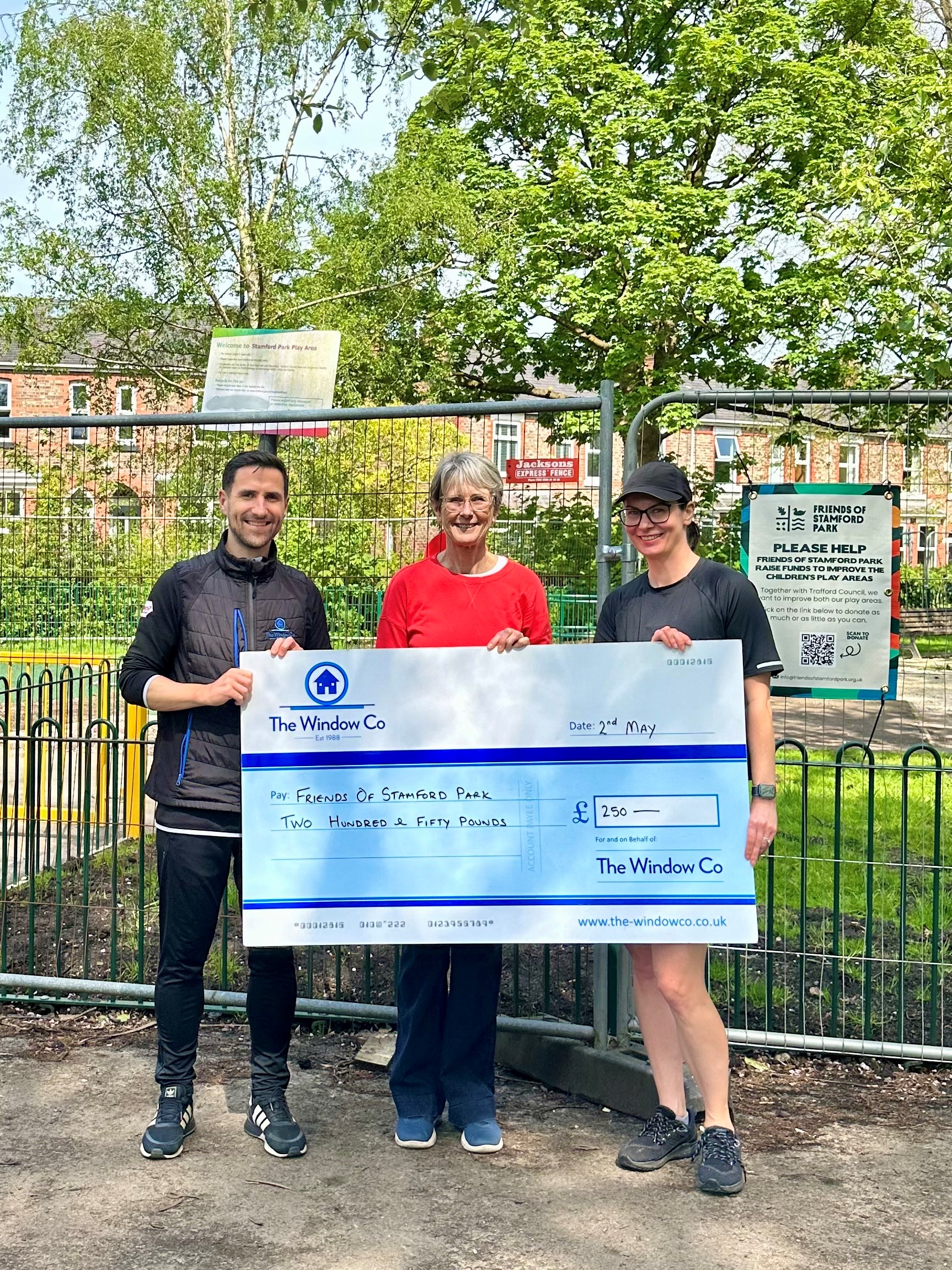 photo of check held by staff donating to friends of stanford park - The Windows Co